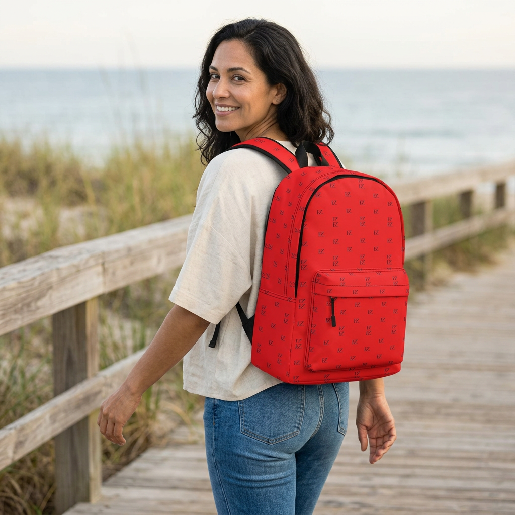 Female model carrying the red backpack on a coastal boardwalk
