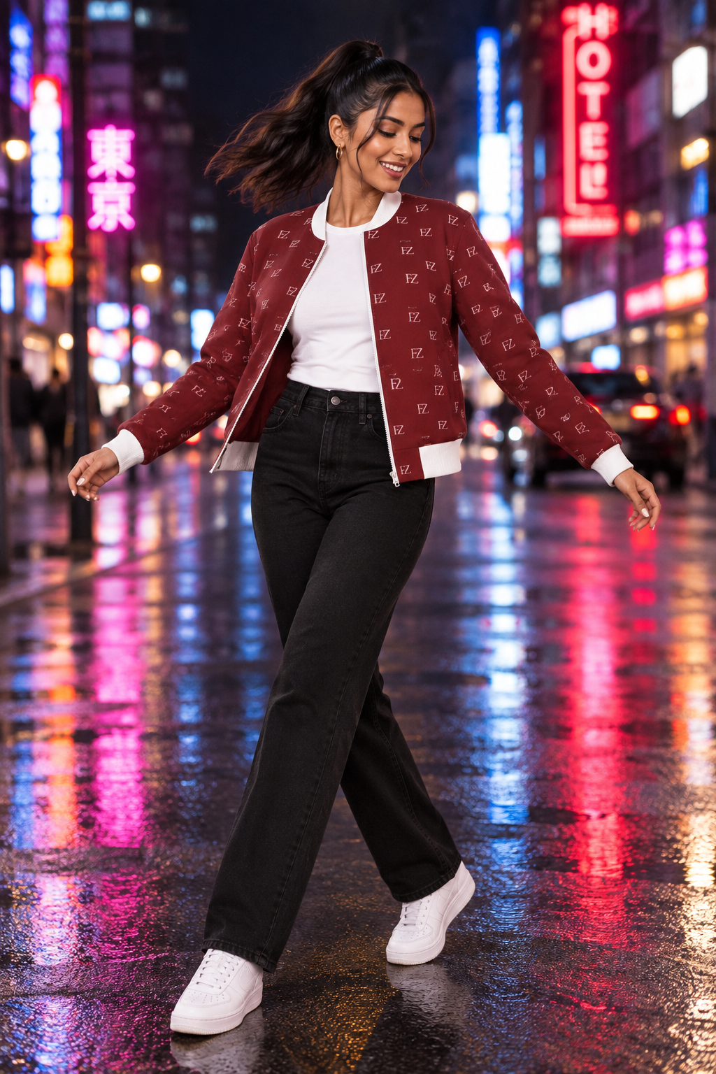 South Asian woman in the women's burgundy FZ bomber on a neon-lit night street