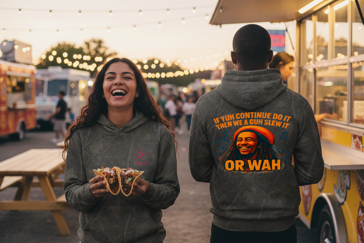 Two friends at a food truck park at dusk wearing the hoodie, front and back visible