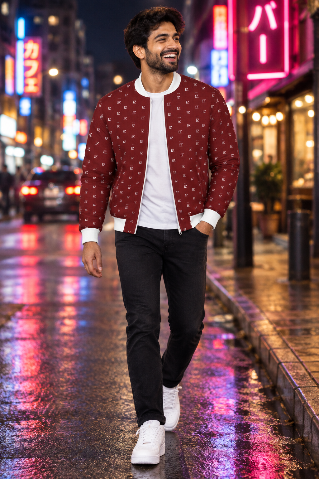 South Asian man in the burgundy FZ bomber on a neon-lit night street