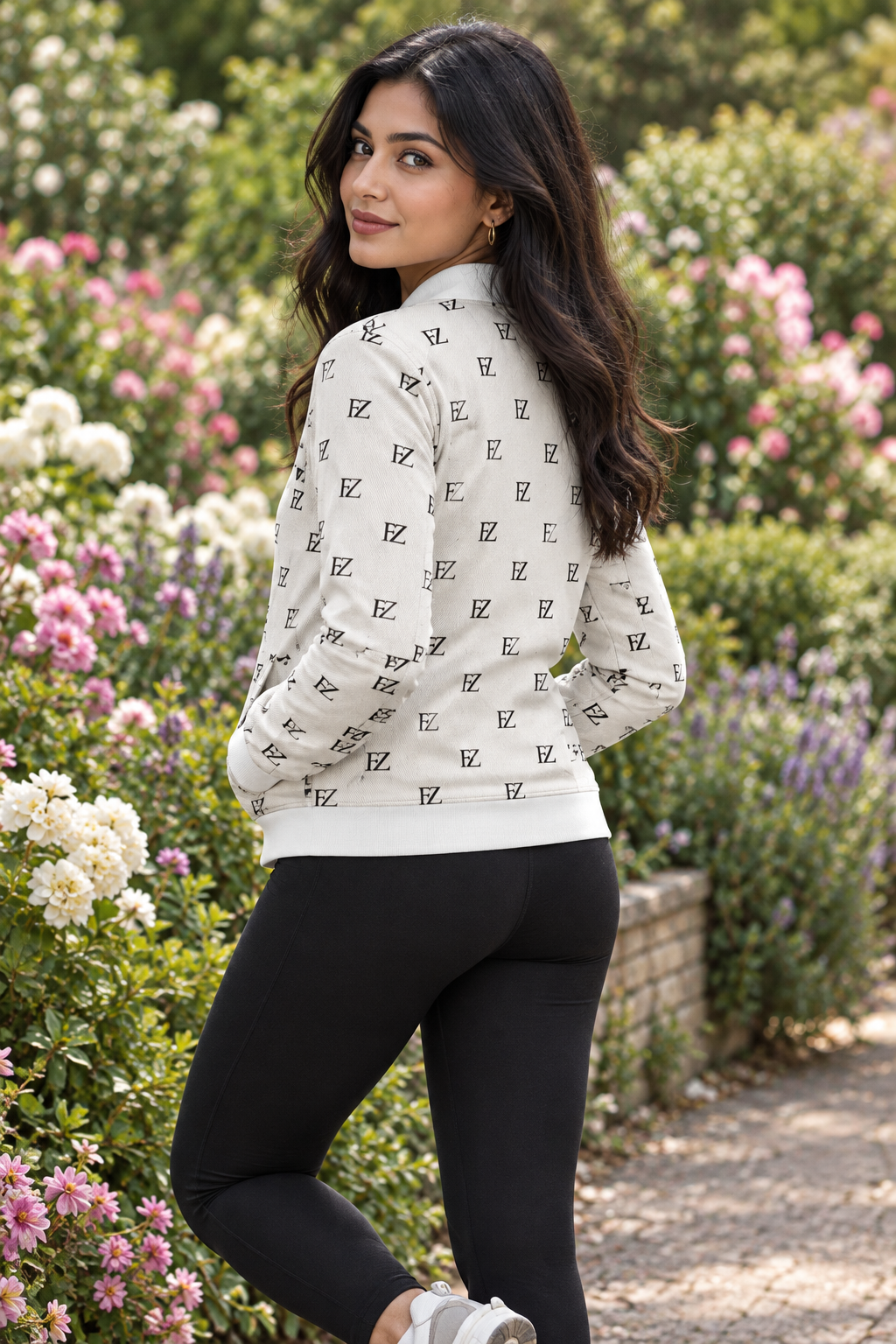 South Asian woman in the women's FZ bomber in a flower garden