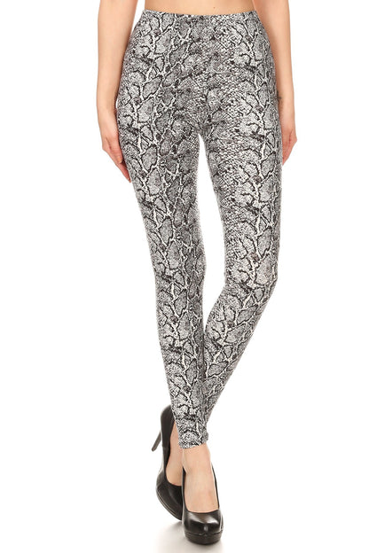 snakeskin print, full length, high waisted leggings in a fitted style with an elastic waistband