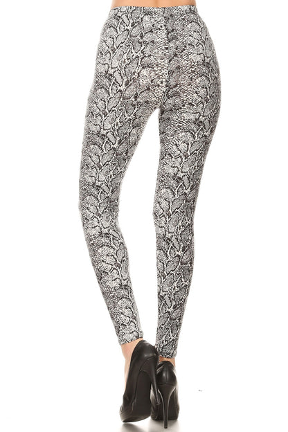 snakeskin print, full length, high waisted leggings in a fitted style with an elastic waistband